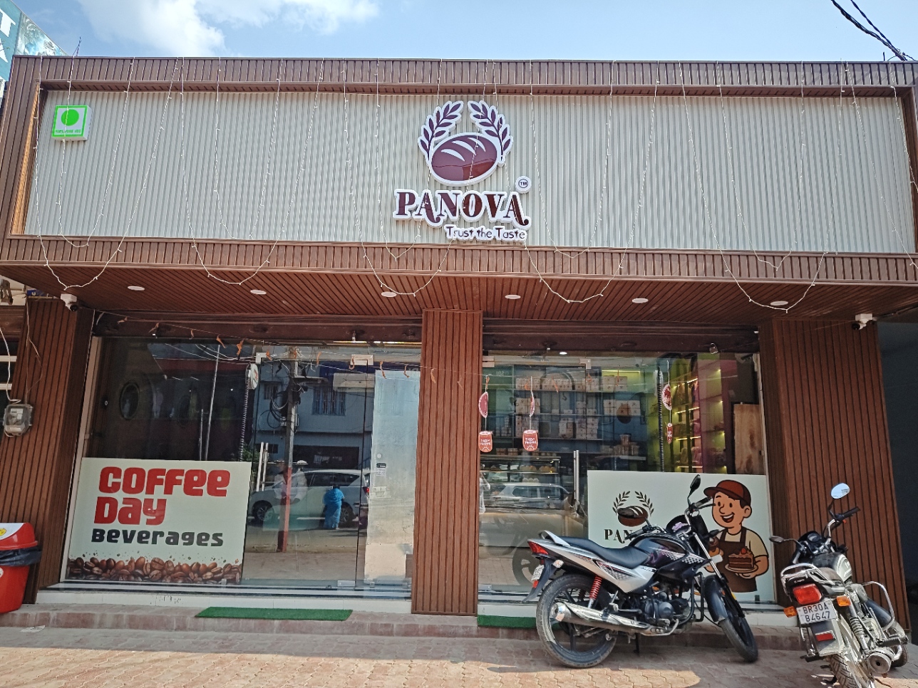 Panova Café welcoming storefront with 3D logo on Rajopatti